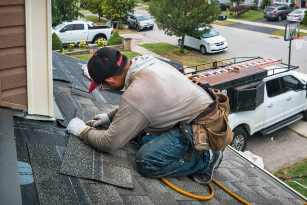 Professional Roofing technician working in Shirley, NY
